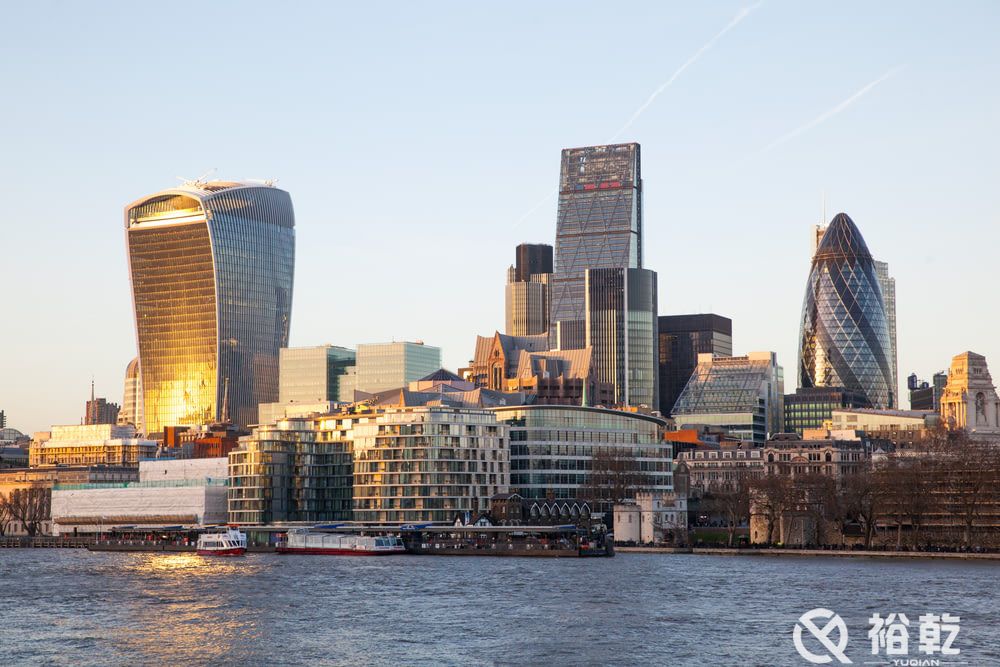 city skyline across body of water during daytime.jpg