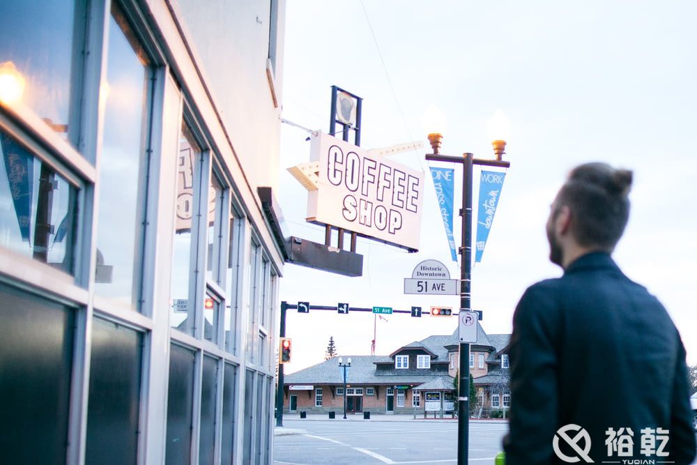 man in front of coffee shop store.jpg